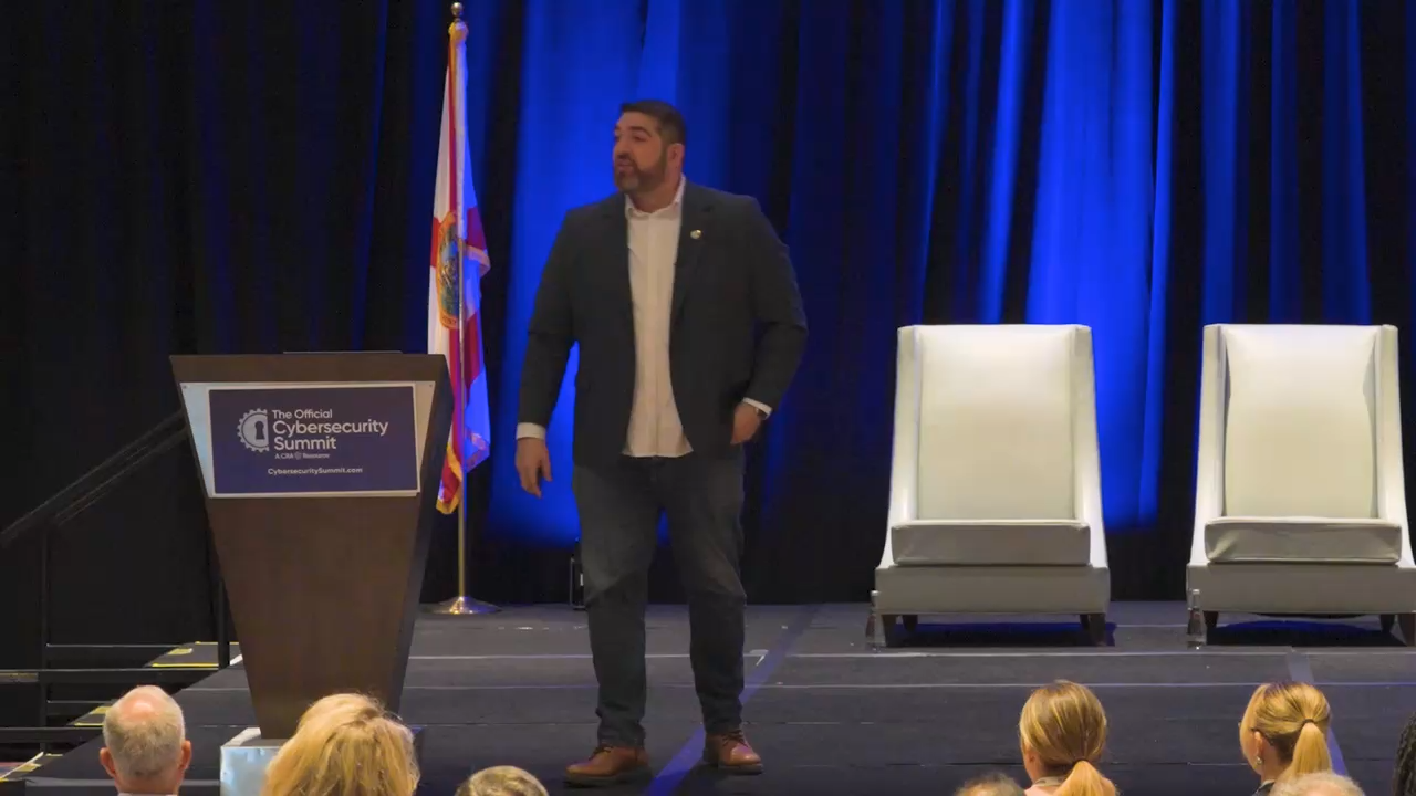 Rob Petrosino speaking to a live conference audience