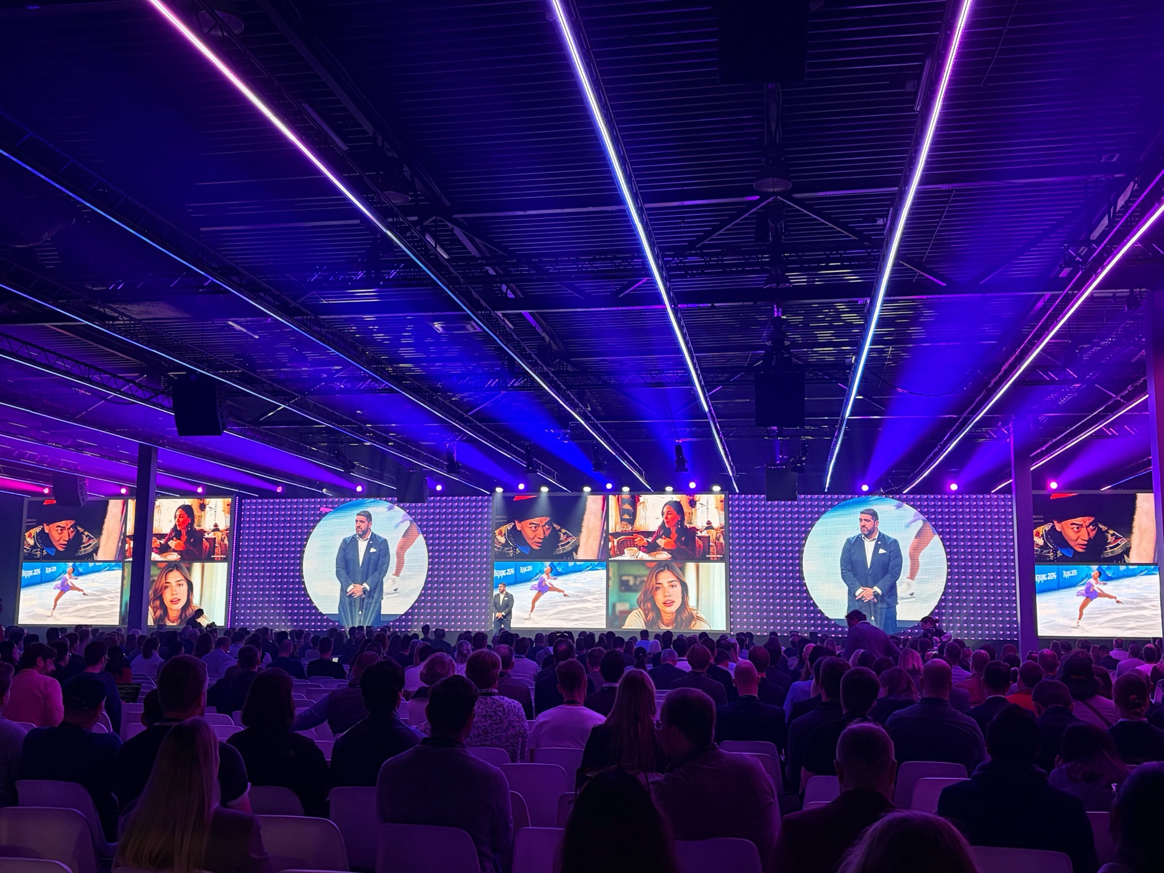 Rob Petrosino speaking in a large conference hall